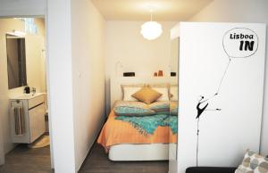 Кровать или кровати в номере Lisboa IN Alcantara