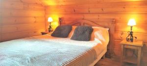 Ένα ή περισσότερα κρεβάτια σε δωμάτιο στο Chalet les Hauts de la Lauzière +5 φωτογραφίες