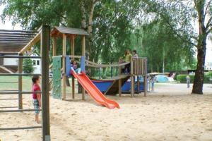 a playground with kids playing on a slide at BARCELONA - Studio mit Sandstrand & Seeblick nahe Rhein-Main und Spessart in Kahl am Main +32 photos