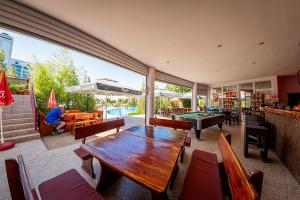 a dining room with a table and ping pong ball at Green Fort Noks - Private apartment - BSR - 3 in Sunny Beach