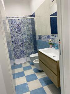 a bathroom with a toilet and a sink and a shower at Mama' in Capri