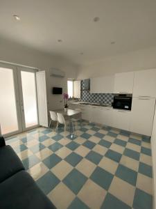 a living room with a checkered floor at Mama' in Capri +5 photos