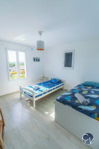 Voodi või voodid majutusasutuse Le Nid des Grands Ducs, Villa avec piscine privée toas