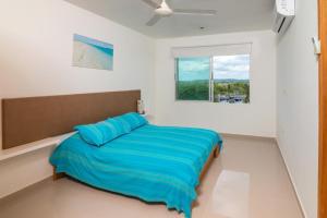 Postel nebo postele na pokoji v ubytování Hermoso Apartamento Frente al Mar 3 Habitaciones B62