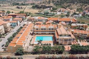 an aerial view of a resort with a swimming pool at Hotel Malaspina in Bosa