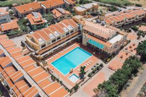 an overhead view of a building with a swimming pool at Hotel Malaspina in Bosa