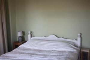 Postel nebo postele na pokoji v ubytování Proeverij de Azijnmakerij
