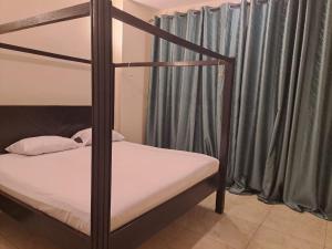 Ένα ή περισσότερα κρεβάτια σε δωμάτιο στο Sunset Haven Homes +15 φωτογραφίες