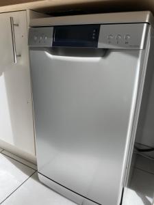 Kuchyňa alebo kuchynka v ubytovaní Parking privé gratuit, balcon, 2 chambres