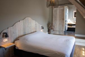 Postel nebo postele na pokoji v ubytování Wertemerhoeve Vakantiewoningen