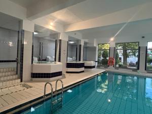 Bazén v ubytovaní Olymp 114 i 120 z basenem, sauną i jacuzzi w cenie alebo v jeho blízkosti