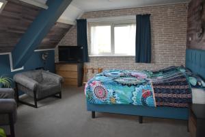 Posezení v ubytování Hotel Dichtbijzee