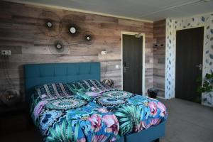 Postel nebo postele na pokoji v ubytování Hotel Dichtbijzee