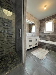 a bathroom with a shower and a sink at Capcos in Escource +15 photos