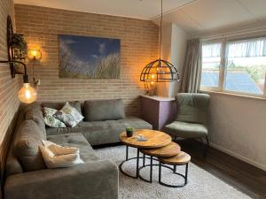 Posezení v ubytování Hotel Dichtbijzee