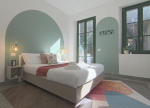 Postel nebo postele na pokoji v ubytování Cà del Lasco - Modern Apartments in Classic Villa