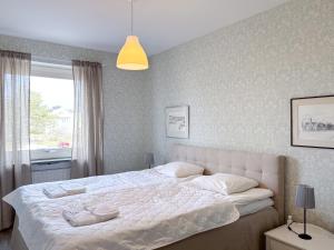 Postel nebo postele na pokoji v ubytování Säffle Suites by Svaneholm Hotel