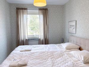 Postel nebo postele na pokoji v ubytování Säffle Suites by Svaneholm Hotel