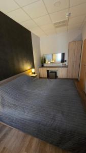 Postel nebo postele na pokoji v ubytování Dorka Apartman Zalakaros + 18 fotografií