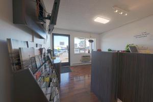 an office with a counter with books on it at OYO Hotel St Helens OR in Saint Helens