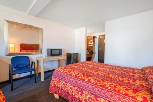 Postel nebo postele na pokoji v ubytování Unicorn Inn by OYO Portland