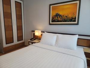 Postel nebo postele na pokoji v ubytování Luxeden Hotel Hanoi