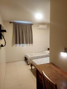 Postel nebo postele na pokoji v ubytování Colina Park Hotel