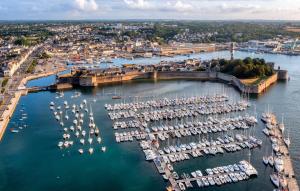 an aerial view of a marina with boats in the water at -LE SENTIER- Elegant T3 avec jardin proche mer in Concarneau
