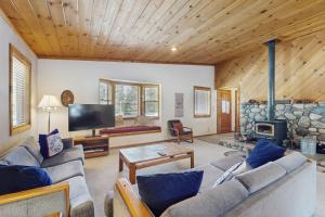 a living room with a couch and a fireplace at Tuna Bush in Truckee