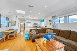 a living room with a couch and a table at 342E Upper 342 Eucalyptus Upper in Avalon