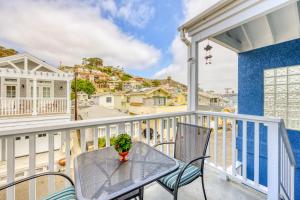 a patio with a table and chairs on a balcony at 342E Upper 342 Eucalyptus Upper in Avalon