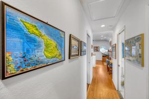 a hallway with a map on the wall at 342E Upper 342 Eucalyptus Upper in Avalon +5 photos
