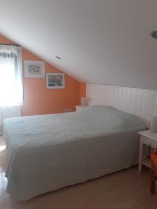 A bed or beds in a room at Hostal Casa Martinez