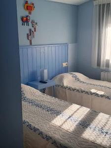 A bed or beds in a room at Hostal Casa Martinez