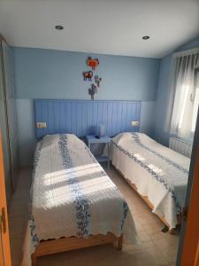A bed or beds in a room at Hostal Casa Martinez