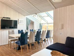 a dining room with a table and chairs at Strandblick - Dorf 1 Ferienhaus 07 in Priwall