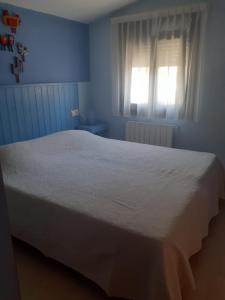 A bed or beds in a room at Hostal Casa Martinez