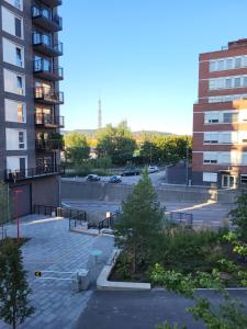 a parking lot in a city with a building at Oslo Golden Choice in Oslo