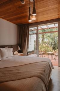 Postel nebo postele na pokoji v ubytování Puerto Dijama Hotel Boutique + 282 fotografií