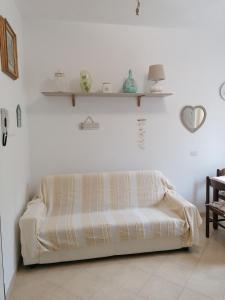 a bed in a room with shelves on the wall at Da Cate in Monterosso al Mare
