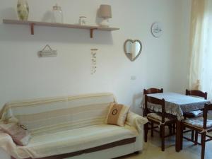 a living room with a couch and a table at Da Cate in Monterosso al Mare +22 photos