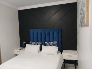 Postel nebo postele na pokoji v ubytování Budget Friendly And Modern Private Rooms