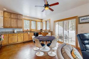a kitchen with a table and chairs in a room at Deer Trail in McCall