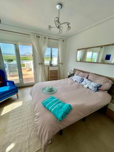 En eller flere senge i et værelse på Casa Tor-relax at the Torre golf resort