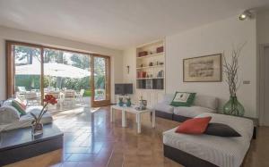 a living room with a couch and a table at Villa Lanzini in Casa Mora