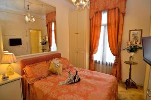 Postel nebo postele na pokoji v ubytování Palazzo Odoni