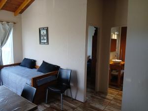 Postel nebo postele na pokoji v ubytování Cabaña La Retama + 12 fotografií