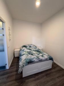 a bedroom with a bed in the corner of a room at 86 1 City Appartement in Enschede