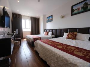 Giường trong phòng chung tại Hotel Trang Tây