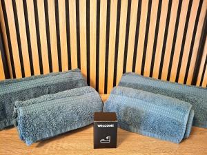 two pillows sitting on a wooden floor in a room at Artistika on the beach in Bibione